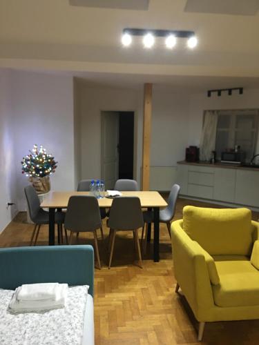 a living room with a table and chairs at WONDER CRACOW in Krakow