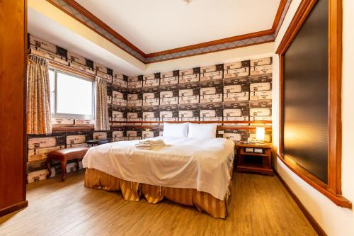 Postel nebo postele na pokoji v ubytování I HI Sanduo Travel Hotel