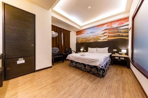 Postel nebo postele na pokoji v ubytování I HI Sanduo Travel Hotel