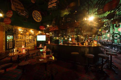 a bar with bar stools in a room at Radisson Hotel President Old Town Istanbul in Istanbul