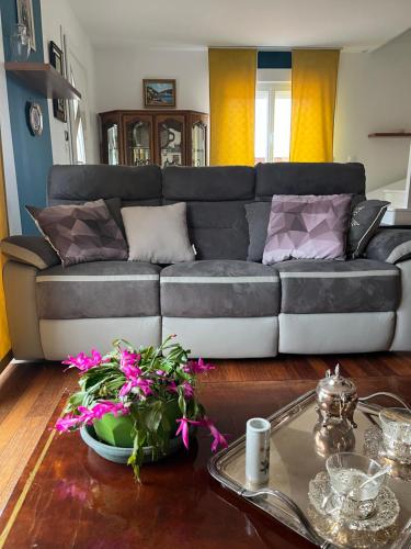 a living room with a couch and a table at Gite en Normandie in Rugles