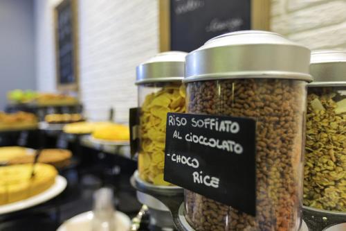 three jars of nuts on display in a store at La Meridiana Bleisure Hotel in Perugia