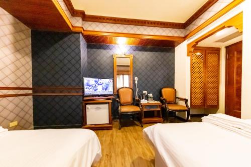 Postel nebo postele na pokoji v ubytování I HI Sanduo Travel Hotel