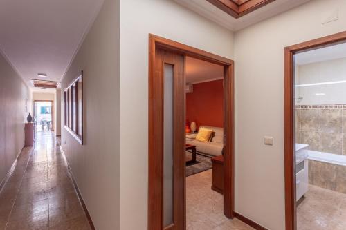 a hallway of a house with a bedroom at Porto Residence Campanhã in Porto