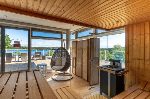 a house with a view of the water at Kongresshotel Potsdam am Templiner See in Potsdam