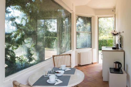 a dining room with a table and a large window at Villa Maria Hotel & SPA in Francavilla al Mare