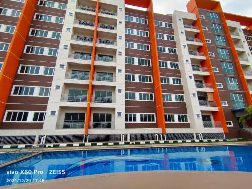 an apartment building with a swimming pool in front of it at Pavilionvillie M1T570 by irainbow in Ipoh