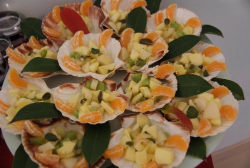 a bunch of fruit in a bowl with oranges at Residence Aprilia in Grado