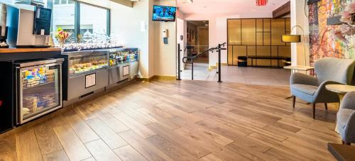 a lobby with a counter and chairs in a store at ARC HOTEL Washington DC, Georgetown in Washington