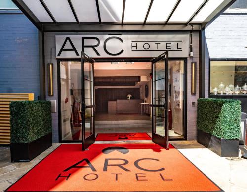 a store front with a red carpet in front of a store at ARC HOTEL Washington DC, Georgetown in Washington