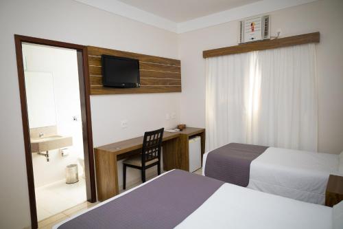 Postel nebo postele na pokoji v ubytování Real Palace Hotel