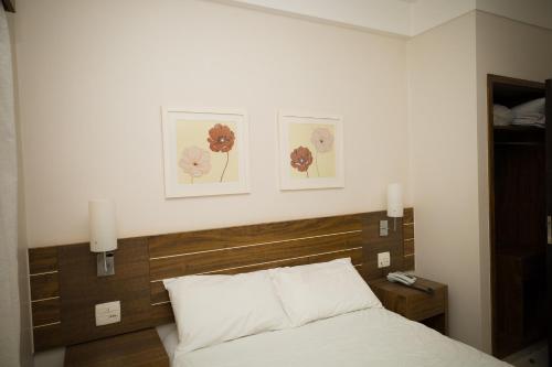 Postel nebo postele na pokoji v ubytování Real Palace Hotel