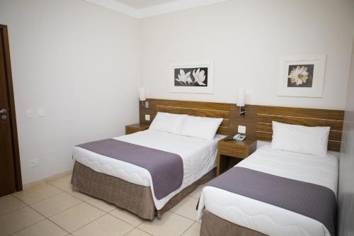 Postel nebo postele na pokoji v ubytování Real Palace Hotel