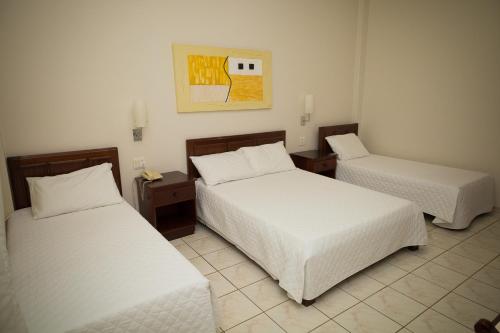 Postel nebo postele na pokoji v ubytování Real Palace Hotel