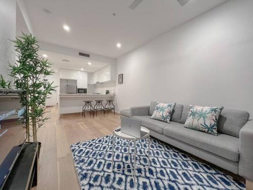 a living room with a couch and a rug at 1.5BR apartment Fortitude Valley in Brisbane