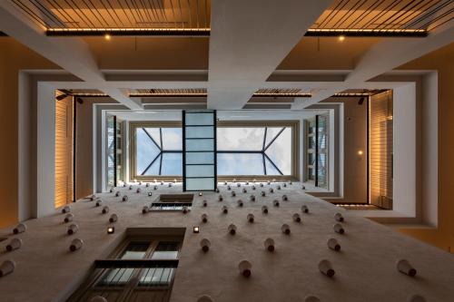 a large room with a large table and chairs in it at ICON Malabar in Málaga