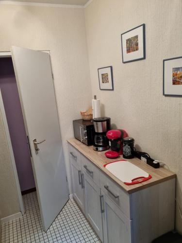 a kitchen with a counter with a coffee maker on it at Apartment Tina in Winterberg