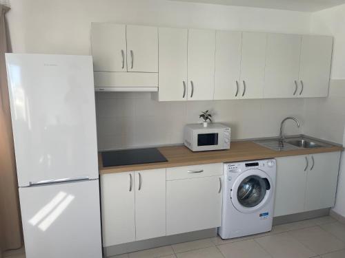 Kuchyň nebo kuchyňský kout v ubytování Apartamentos Tao Laia