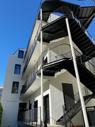 an external view of a building with a spiral staircase at Lisbon City Hollywood Hotel by City Hotels in Lisbon