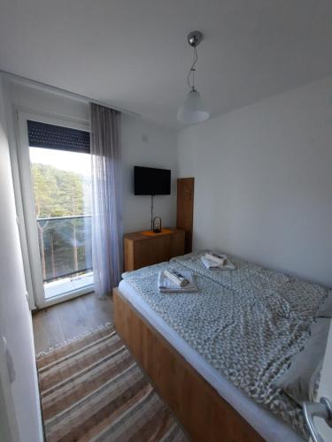Postel nebo postele na pokoji v ubytování Goga Apartmani
