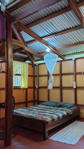 Ein Bett oder Betten in einem Zimmer der Unterkunft Cabinas Algebra