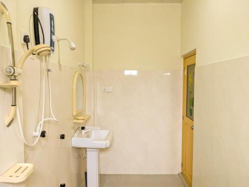 a bathroom with a sink and a shower at Sigiri Choona Lodge 'unique sunrise viewpoint' in Sigiriya