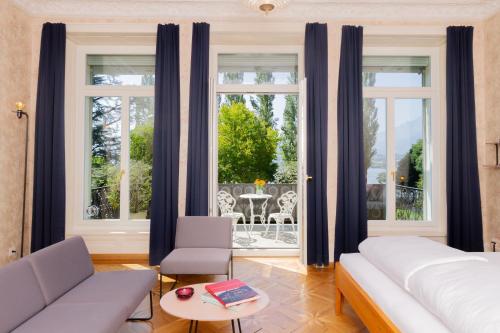 Postel nebo postele na pokoji v ubytování Hotel Beau Séjour Lucerne