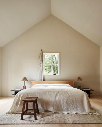 a bedroom with a large bed and a window at Inness in Accord
