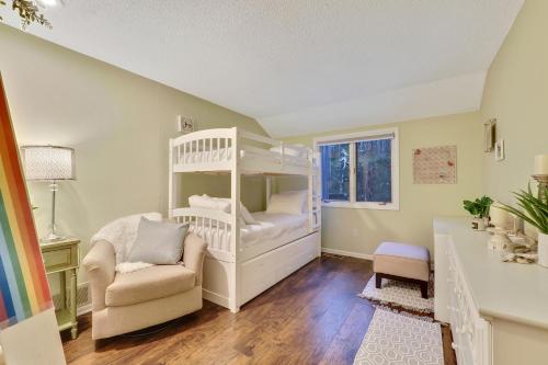 a bedroom with two bunk beds and a chair at Harbor Cove Shores in Harbor Springs