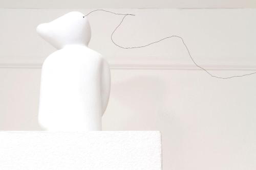 a white vase sitting on top of a table at Hotel Beau Séjour Lucerne in Luzern