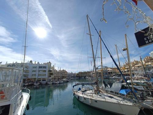 a group of boats docked in a harbor at Benal Beach 907 in Benalmádena