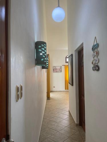 a hallway with a refrigerator in a room at Ocean Breeze Villa Carismar in Cabrera
