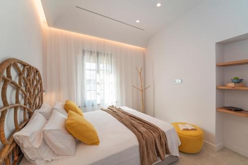 Ένα ή περισσότερα κρεβάτια σε δωμάτιο στο Naillac Elite Suites