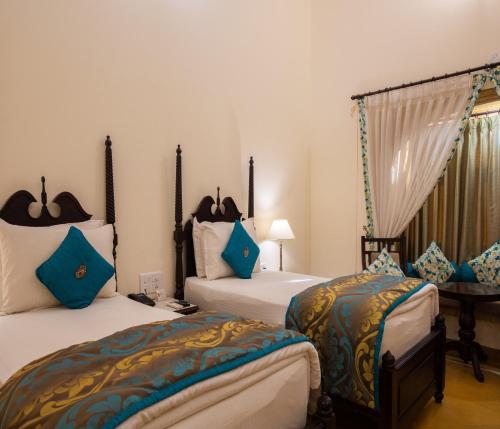 Postel nebo postele na pokoji v ubytování SKK The Fern An Ecotel Hotel, Jaisalmer
