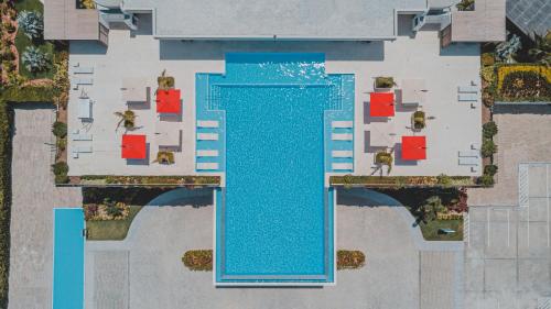 an aerial view of a swimming pool in a resort at Radisson Blu Aruba in Palm-Eagle Beach