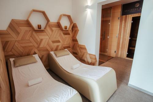Postel nebo postele na pokoji v ubytování Apartments & Wellness Skok