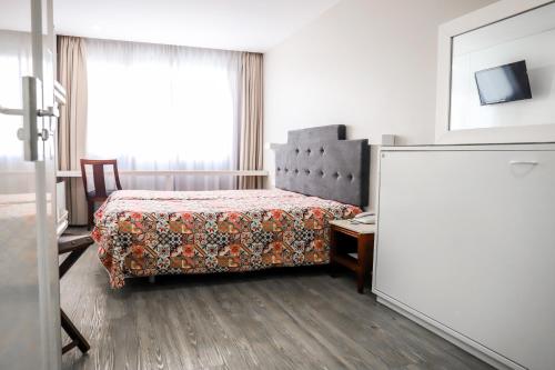 Hotel Avenidaにあるベッド