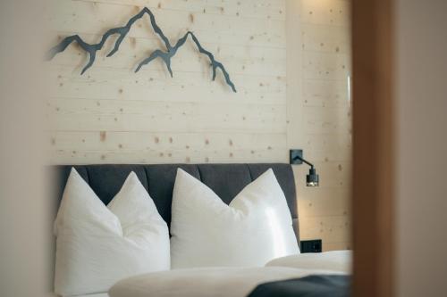 Ένα ή περισσότερα κρεβάτια σε δωμάτιο στο Appartements Höllhaus