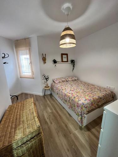a bedroom with a bed and a window at Anne´s Corner in Cala del Moral