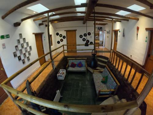 an overhead view of a living room with a couch at Rey Lagarto Hostel in San Pedro de Atacama