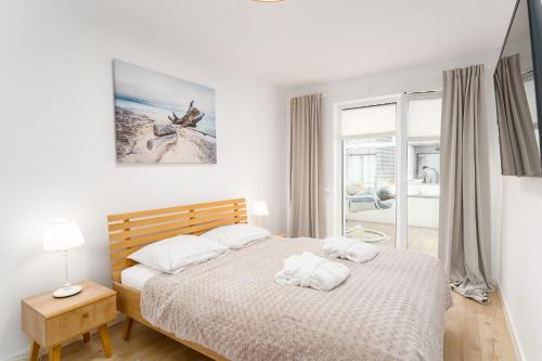 Posteľ alebo postele v izbe v ubytovaní Nadmorskie Tarasy Apartament 215 A Eltom Tour