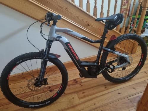 a bike is parked next to a staircase at Clava Cottage City Centre in Inverness
