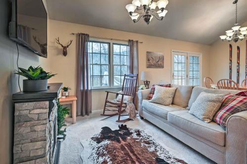 a living room with a couch and a fireplace at Hike, Bike and Swim Mountain Escape with Deck in Clear Spring