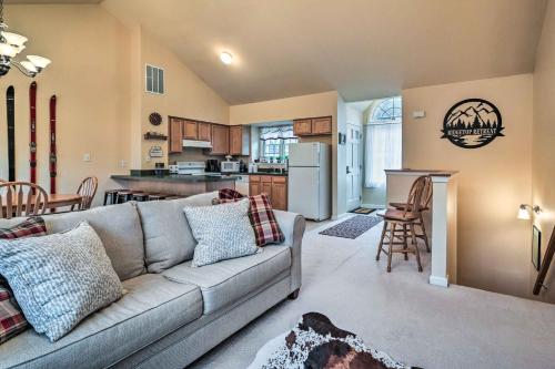 a living room with a couch and a kitchen at Hike, Bike and Swim Mountain Escape with Deck in Clear Spring
