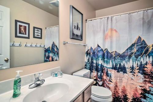 a bathroom with a sink and a toilet and a shower curtain at Homey Ridgetop Retreat - Walk to Hiking and Biking in Clear Spring