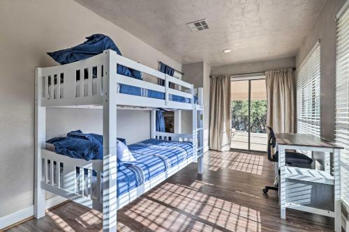 a bedroom with two bunk beds and a desk at Canyon Lake Home Hill Country and Water Views! in Canyon Lake