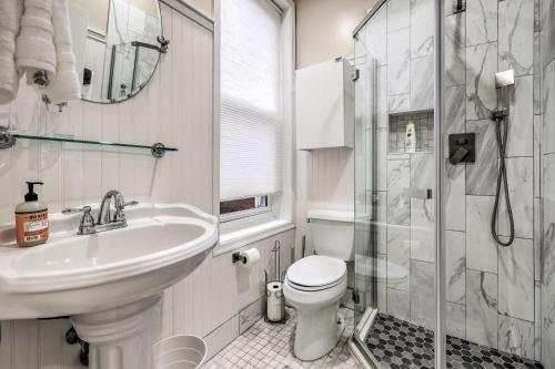 a bathroom with a sink and a toilet and a shower at Modern Townhome in Historic Dtwn Alexandria! in Alexandria