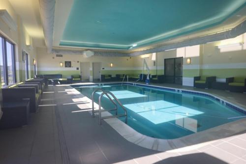 a large swimming pool in a building at Comfort Suites Bossier City - Shreveport East in Bossier City
