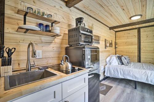 a kitchen with a sink and a stove at Tiny Home with Hot Tub By Mohican State Park! in Loudonville