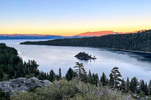 an island in the middle of a lake with trees at 2 Mi to Beaches and Trails Tahoe Area Home with Sauna in Stateline